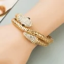 Rigid bracelet in the shape of a gold snake